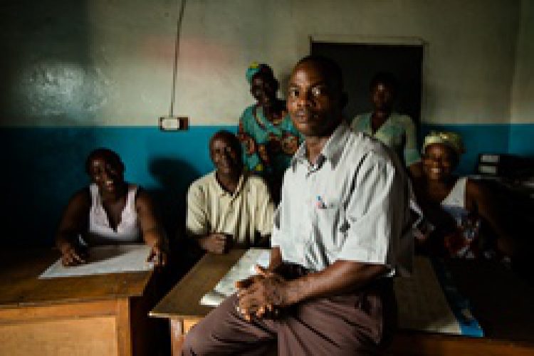 West Point, Monrovia, Liberia - Dec 18, 2013: Thomas Tweh, founder of the West Point Health & Sanitation Organization. 

When citizens face legal challenges, the lack of legitimacy, affordability, accessibility and timeliness of the formal justice system often prevents any feasible recourse. Extensive bureaucratic red tape coupled with transportation and legal costs, lawyer fees, and opportunity costs of foregone work make the justice system not only physically but also financially unavailable to many.

The judiciary and police were recently ranked as the most corrupt set of institutions in the country by the government itself – which not only undermines any sense that wrong-doing will be punished but has hollowed out trust in public processes more broadly. As one citizen pointed out to us recently: “There is simply no justice for the poor.”

Thomas Tweh, a community leader in the West Point neighborhood, had an innovative idea to resolve these justice issues at the local level. His plan was not to avoid or override the formal justice system, but to collaborate with the police and commissioner’s office to refer cases downwards from the courts to a community dispute resolution mechanism run by volunteer mediators. Photo by Morgana Wingard